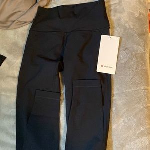 Black lululemon Wunder Under HR Tight 28”  black pant size 4. new never worn